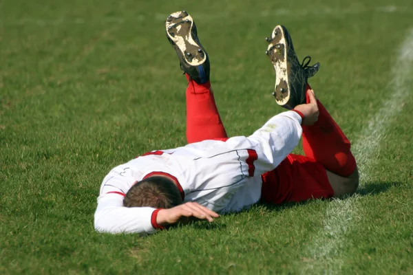 Un jugador de fútbol herido Fotos de stock libres de derechos