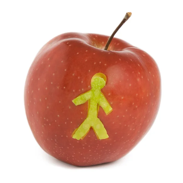 Jablko s solhouette člověka — Stock fotografie