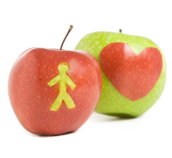 Два яблока с силуэтами — стоковое фото