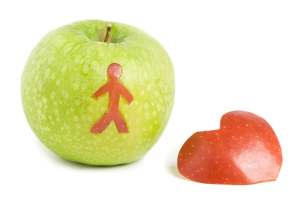 Grönt äpple med rött hjärta — Stockfoto