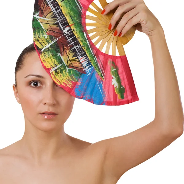 Красивая женщина с раскладным вентилятором — стоковое фото