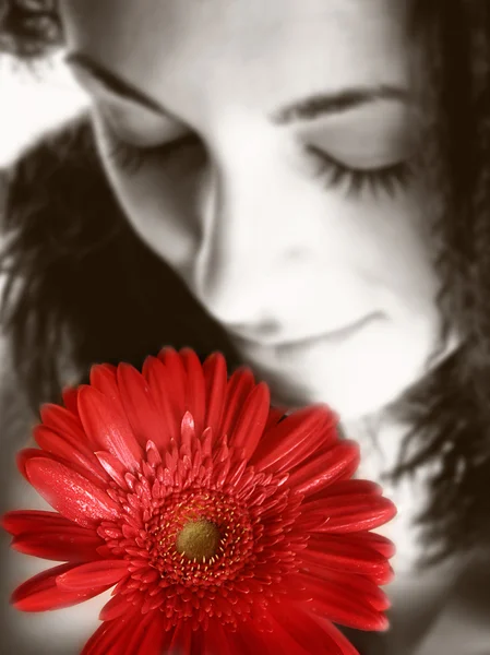 Girl with a red flower — Stock Photo, Image