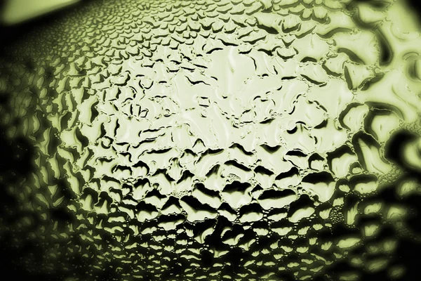 Gotas verdes de água - luz da parte traseira. Macro — Fotografia de Stock