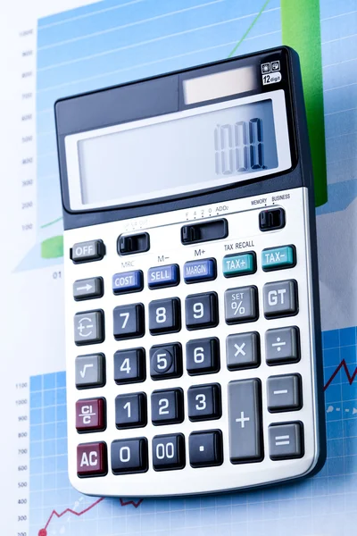 Miniräknare och diagram, finans-serien — Stockfoto