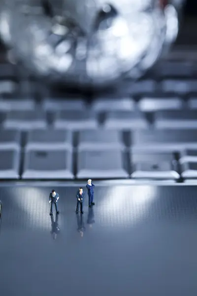 stock image Laptop with figure over chrome background