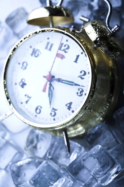 stock image Classical Clock among ice cubes