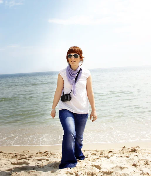 stock image Young woman on the beach