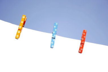 Colorful wooden pegs clipart