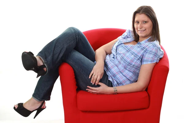 Girl on armchair — Stock Photo, Image