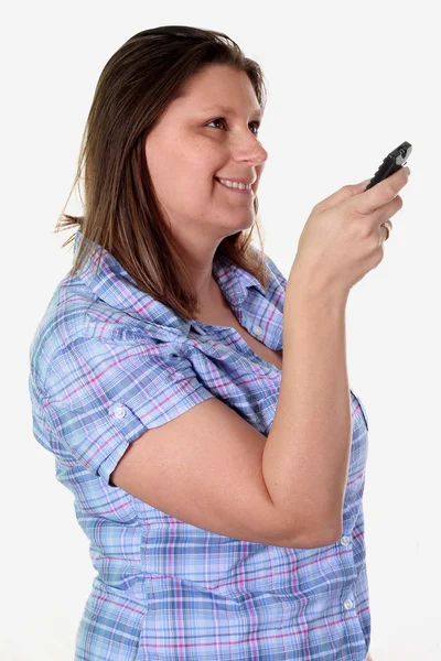 Beautiful girl with remote control — Stock Photo, Image
