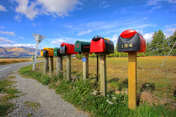 Stock image Colorful row of post boxes