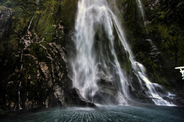 Dramatic image of a waterfall at Milford Sound