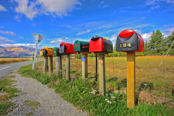 stock image Colorful row of post boxes