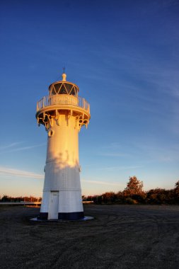 Lighthouse at sunset clipart