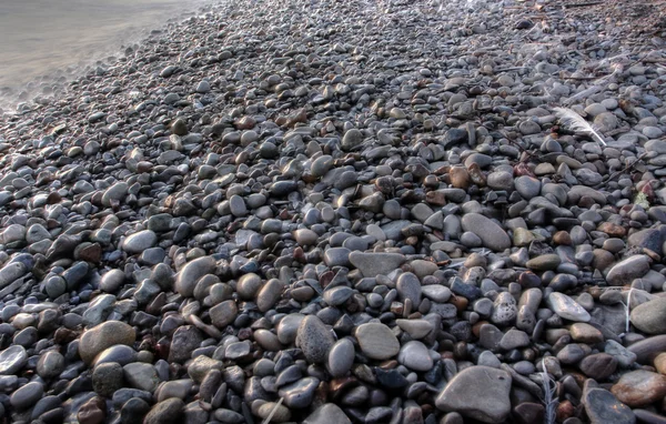 stock image Pebble beach lakescape