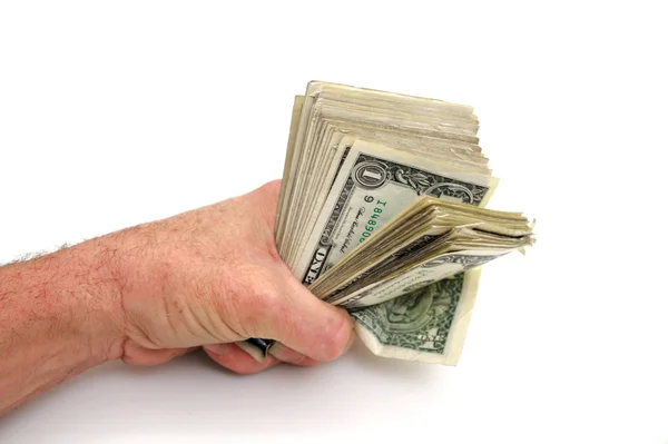 Кулак полный долларов — стоковое фото