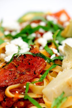 Fettuccini With Suateed Tomatoes And Basil clipart