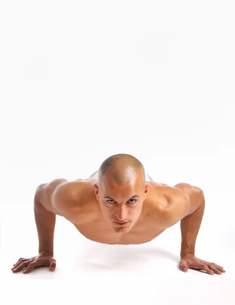 Young man doing a pushup — Stock Photo, Image