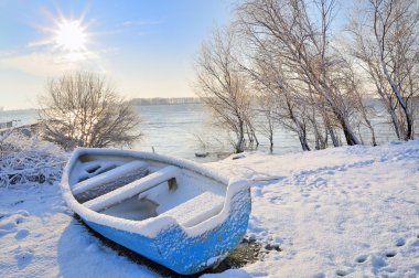 Blue boat on danube river clipart