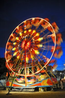 Ferris wheel in a summer night clipart