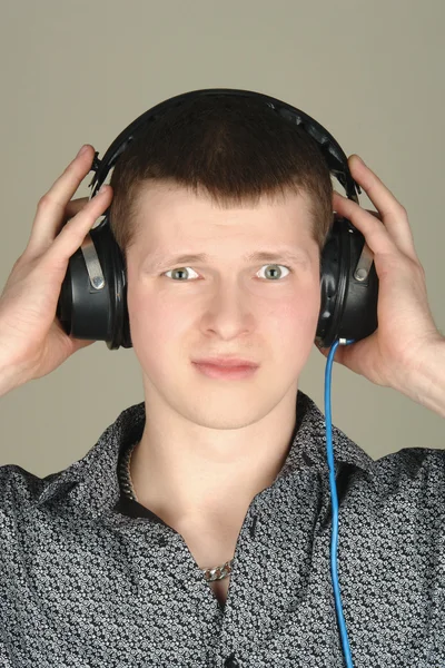 Young man listening a bad music — Stock Photo, Image