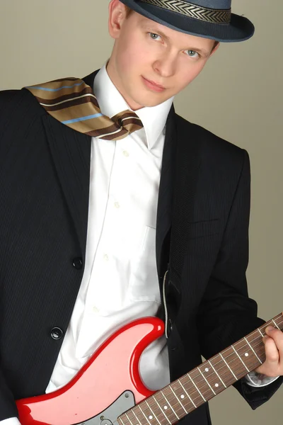 Businessman playing on a guitar — Stock Photo, Image