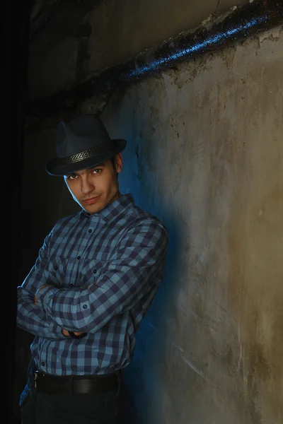 Man in hat blue light portrait — Stock Photo, Image