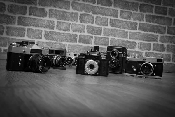 Bw old photo with old photo cameras — Stock Photo, Image