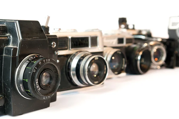 Câmeras de fotos antigas em um branco — Fotografia de Stock