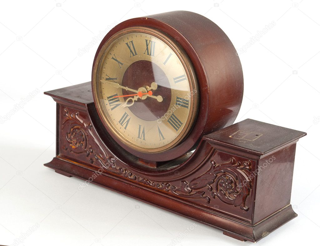 Brown old clock on a white