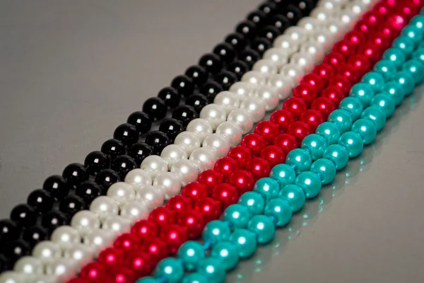 Vier farbige Perlen Linie — Stockfoto