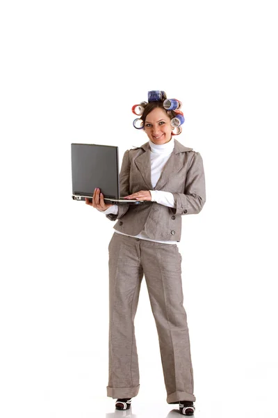 Business woman with curlers and laptop — Stock Photo, Image