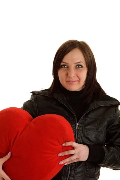 Rockergirl with red heart pillow — Stock Photo, Image