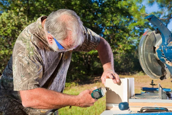 stock image Man Uses a Nail Gun