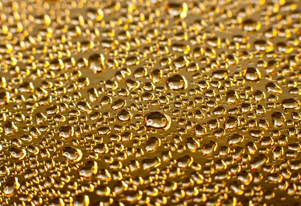 Golden vody kapky — Stock fotografie