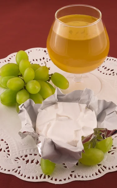 Fresh grapes and cheese with white mold — Stock Photo, Image