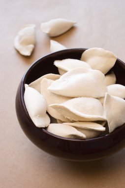 Delicious ravioli in a clay pot