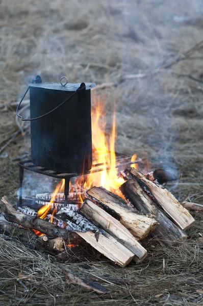 Cooking in a pot on the bonfire — Stock Photo, Image