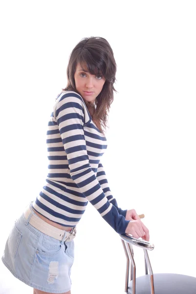 Pretty brunette posing with stool — Stock Photo, Image