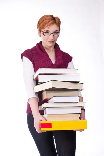 Mädchen mit schweren Büchern — Stockfoto