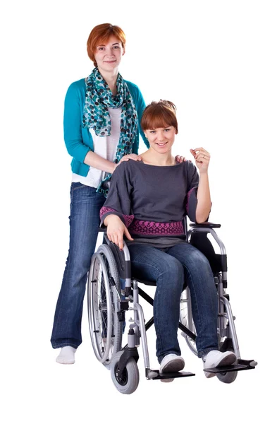 Two girls one on wheelchair — Stock Photo, Image