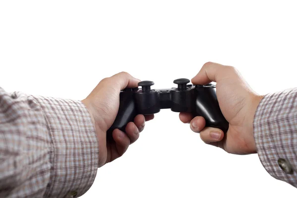 Mãos humanas segurando um controlador de jogos no fundo branco — Fotografia de Stock