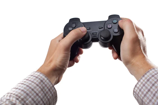 stock image Human hands holding a gaming controller on white background
