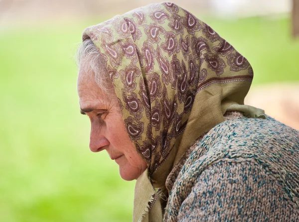 Old woman with kerchief — Stock Photo, Image