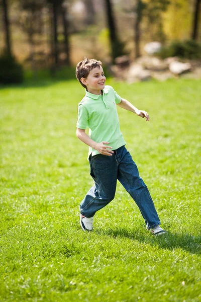 Boy running on a meadow — Stock Photo, Image