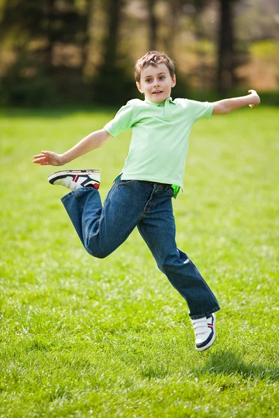 Kid jumping for joy — Stock Photo, Image