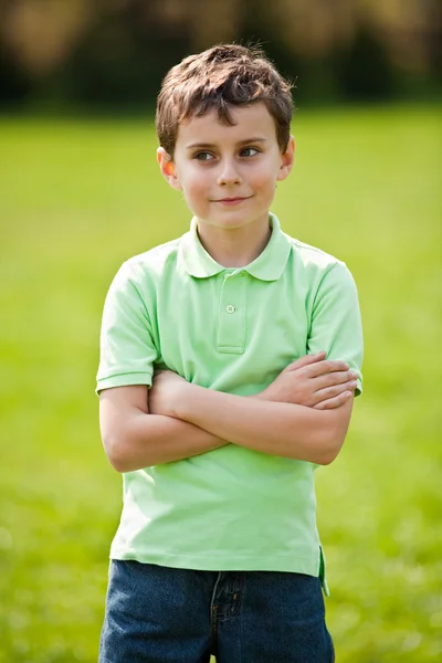 9 years old kid in a park — Stock Photo, Image