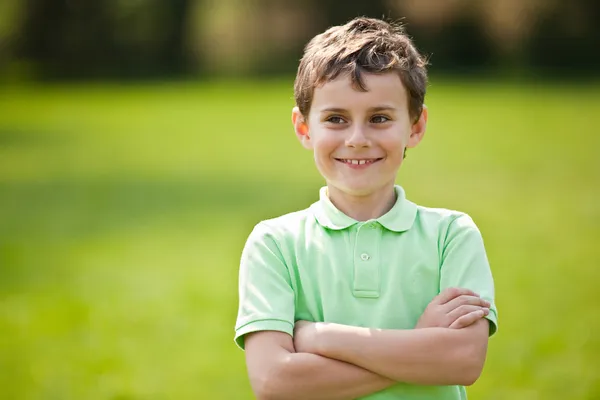 9 years old kid in a park — Stock Photo, Image