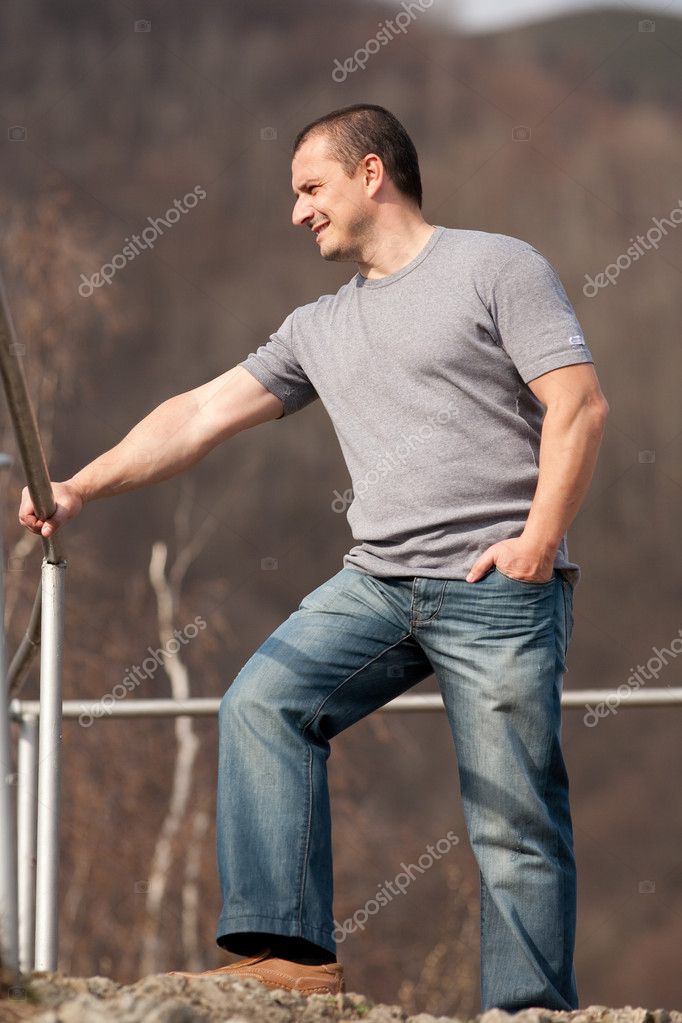 Young man full body portrait outdoors Stock Photo by ©Xalanx 2946844