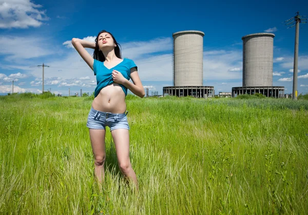 Sexy lady in an industrial background — Stock Photo, Image